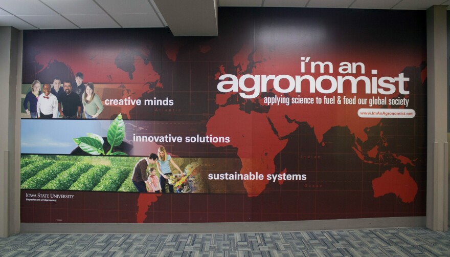 The Des Moines Airport arrivals area is one of many sites across Iowa that has displayed an ad campaign to recruit more different kinds of students into Iowa State University’s Agronomy department.