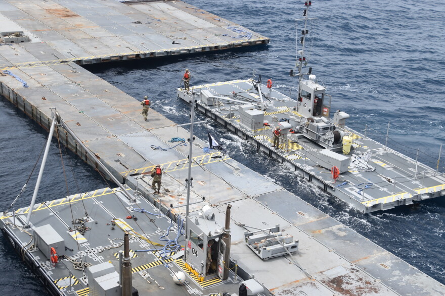U.S. Army Soldiers assigned to the 7th Transportation Brigade and Sailors build pier off the shore of Gaza. April 26, 2024.