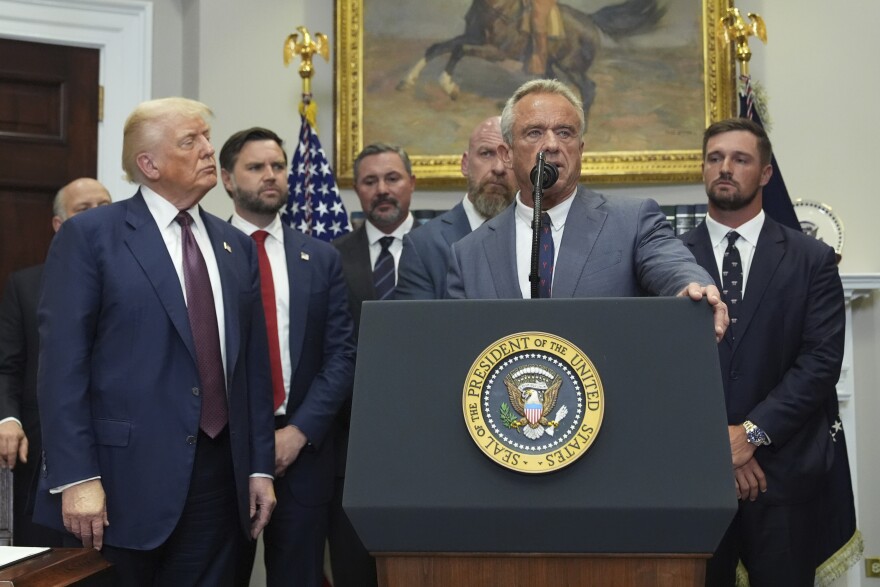 Health and Human Services Secretary Robert F. Kennedy Jr. speaks as President Donald Trump, from left, Vice President JD Vance, Cody Campbell, WWE CCO Triple H and professional golfer Bryson DeChambeau listen during an event for the signing of an executive order restarting the Presidential Fitness Test in public schools, Thursday, July 31, 2025, in the Roosevelt Room of the White House in Washington. (AP Photo/Jacquelyn Martin)