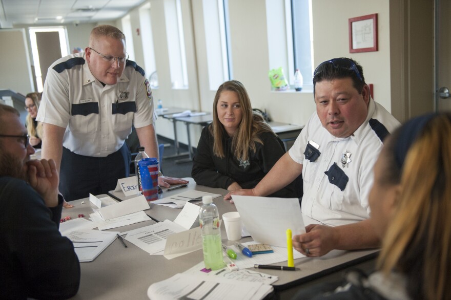 Illinois Department of Corrections officers participate in a role-playing exercise during a March training session on working with female inmates, at Logan Correctional Center in Lincoln, Ill.