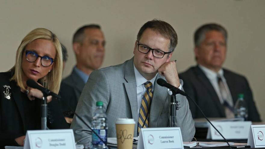 Ryan Petty, who lost his 14-year-old daughter, Alaina, in the Parkland school shooting listens on during a meeting of the Marjory Stoneman Douglas High School Public Safety Commission at the BB&T Center in June 2018. He's now a member of the state Board of Education.