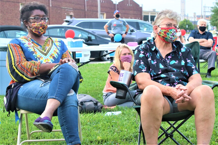 Dee Williamston (left) listens to Democratic U.S. Senate candidate Barbara Bollier at a Sept. 26 rally in Salina, Kansas.