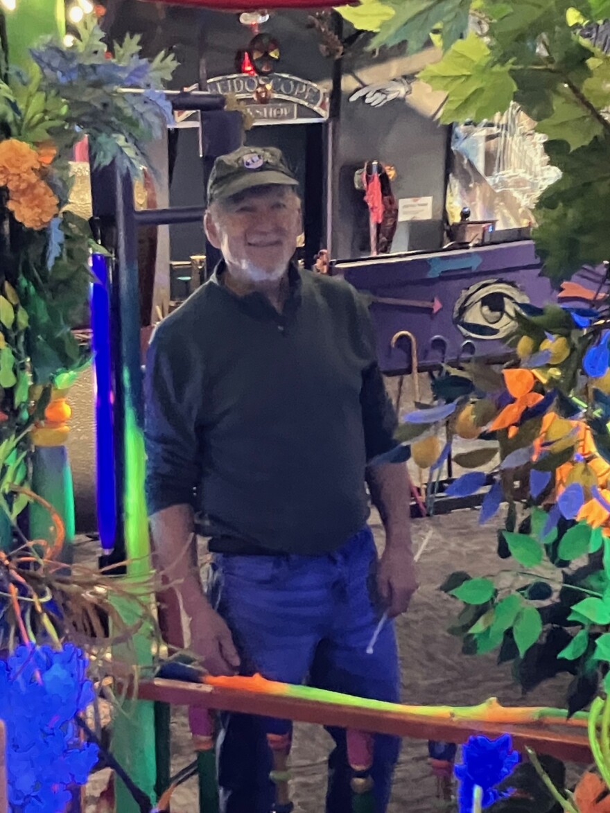 Chouteau, a Davenport West and St. Ambrose alum, reflected in one of the many mirrors in the exhibit, March 31, 2026.