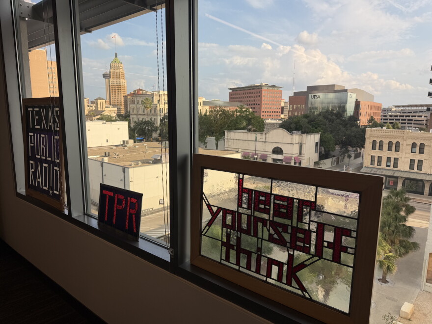 Stained glass by retiring TPR Arts and Culture Reporter Jack Morgan is displayed in the TPR newsroom in downtown San Antonio.