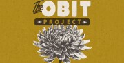 Graphic poster with a mustard yellow background reading “The Obit Project.” The word “The” appears in black script above large white block letters spelling “OBIT.” Below, the word “PROJECT” appears in gold letters inside a black horizontal banner with small decorative arrows on each side. A detailed black-and-white illustration of a large chrysanthemum flower fills the lower half of the design.