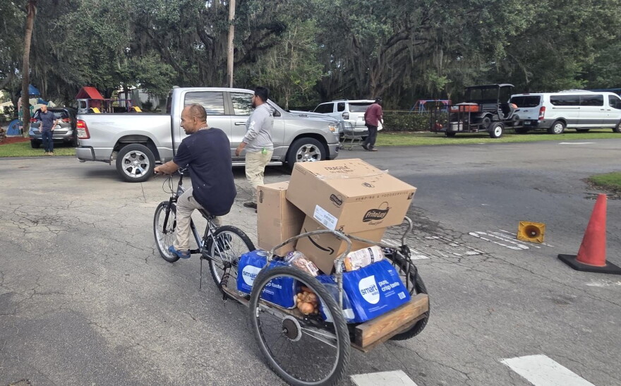 A evening food distribution in Immokalee recently let those who might not be able to attend a daytime event get access to needed food staples and supplies.