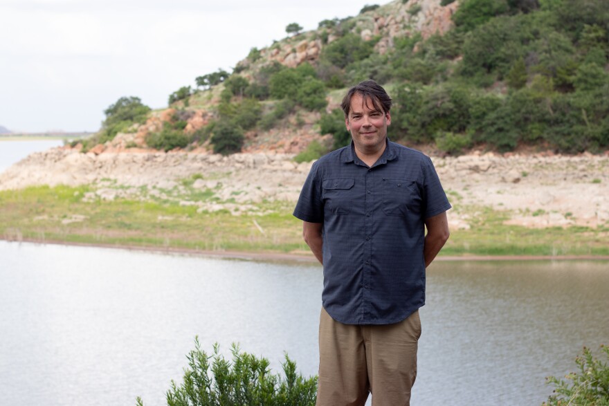 Cleveland percussionist Andrew Pongracz stands beside Lake Altus-Lugert before the performance. Pongracz said it was his first year as an instructor at OSAI and the organization "definitely knows what it's doing."