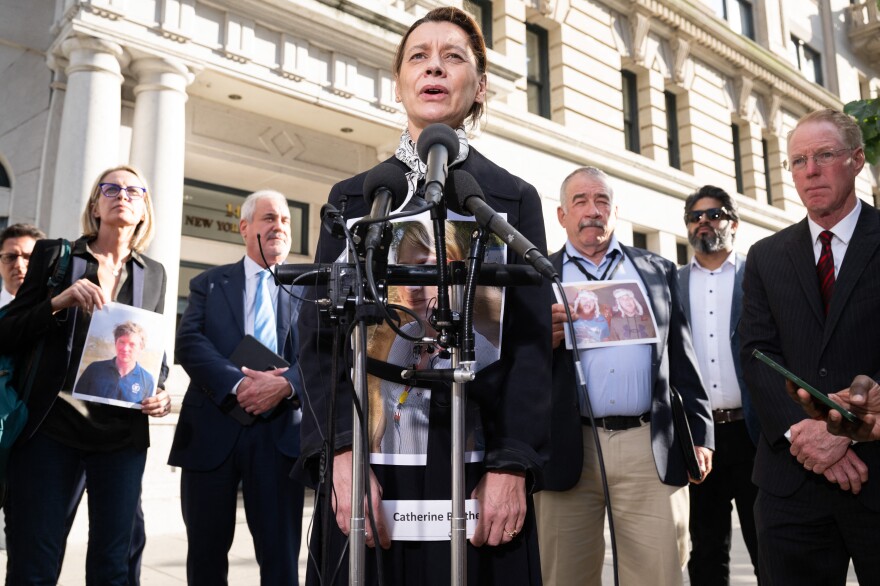 Catherine Berthet of France, whose daughter Camille was killed in the 2019 crash of Ethiopian Airlines Flight 302, speaks Wednesday alongside other family members of victims after meeting with Justice Department officials.