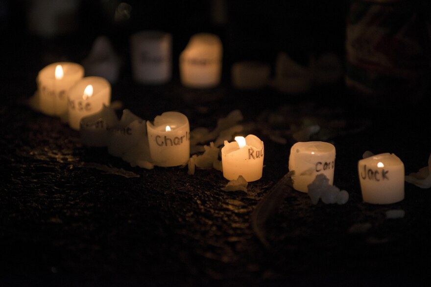 File: Candles with the names of victims of the Sandy Hook Elementary School shooting written on them are seen at a makeshift memorial near the entrance to the grounds of Sandy Hook Elementary School on December 18, 2012 in Newtown, Connecticut.