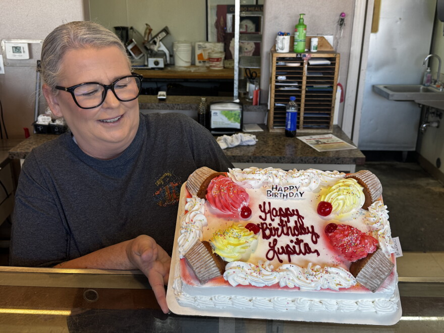 Tammy Jowers is about to box a cake for Lupita, a beloved customer.