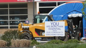 Outside of Indiana University Health's Methodist Hospital, a sign reads, "You are more than essential. Our community stays home for you."