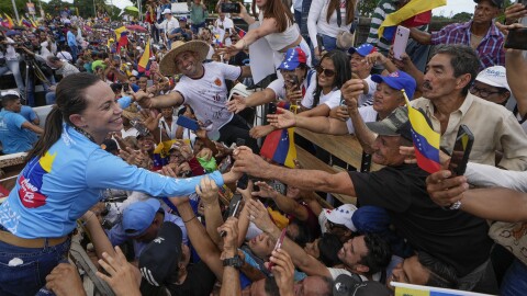 Opposition leader Maria Corina Machado greets supporters during a campaign rally for presidential candidate Edmundo Gonzalez, in Maturin, Venezuela, Saturday, July 20, 2024. The presidential election is set for July 28. (AP Photo/Matias Delacroix)