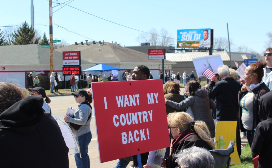 A sign from the Peoria "No Kings" protest reads "I want my country back!"