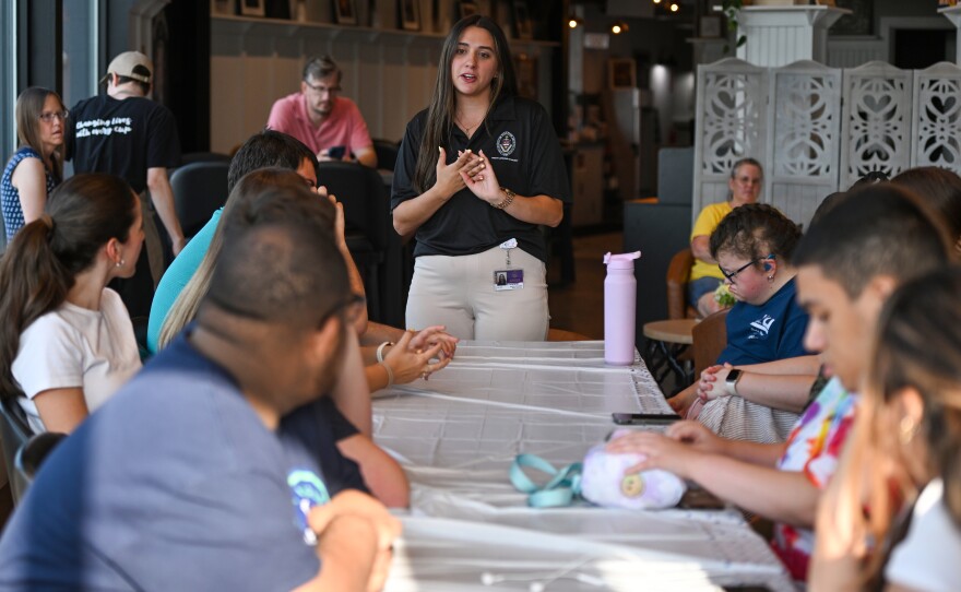 University of Scranton student Julia Gallo speaks to those attending the Coffee Inclusive Fourth of July themed cooking class.