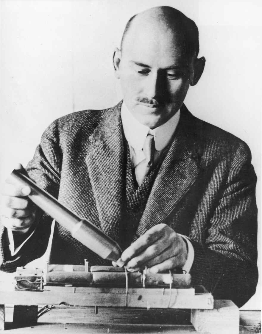 Goddard works with a steel combustion chamber and rocket nozzle, around 1915.