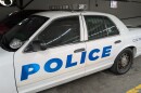 A police car in a garage.