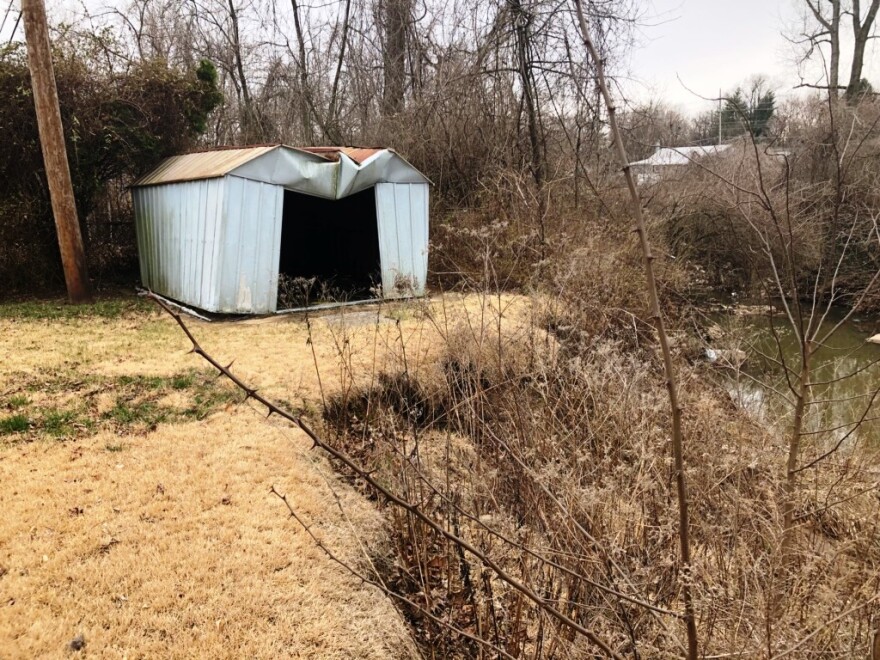 Flooding along Maline Creek, in north St. Louis County, is eroding away the yards of homes on Cedarhurst Drive. 