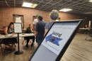 Voters wait their turns to cast their ballots Tuesday, Aug. 13, 2024, for the primary election at the Red Lake polling site at the Red Lake Humanities Center.