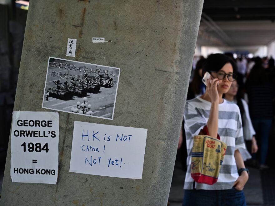 Placards against a controversial extradition law proposal pasted on a wall near the Legislative Council complex in Hong Kong on Friday.