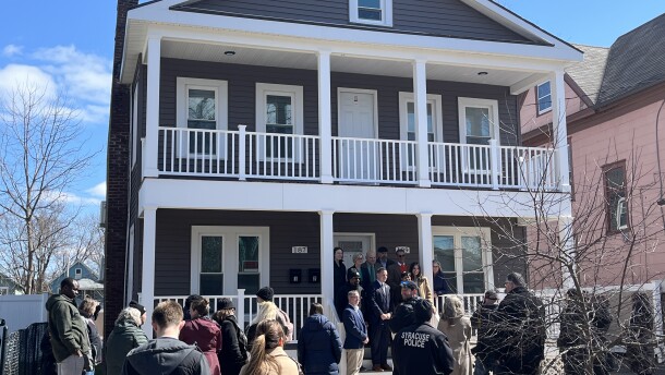 Dignitaries gather in front of the lead-safe house at 187-189 Lincoln Ave. Mar. 24, 2026.