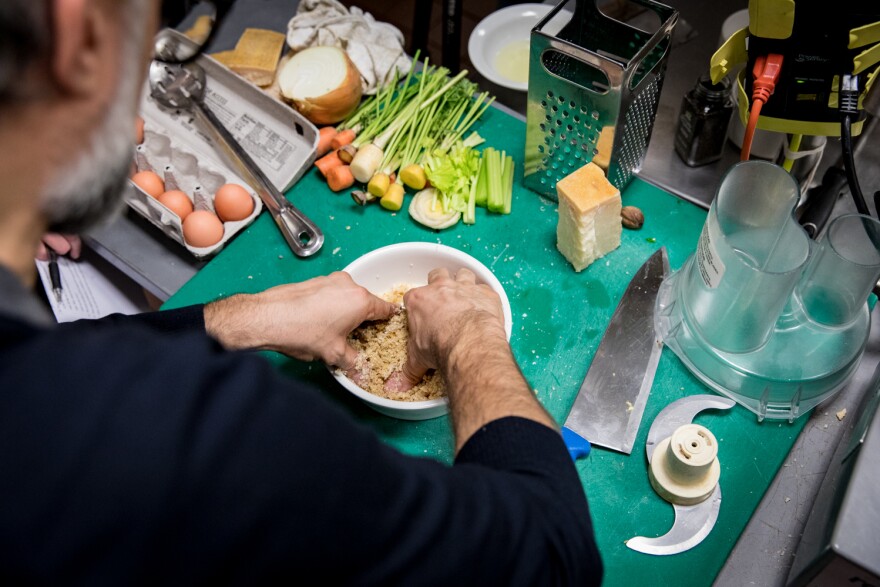 Bottura kneads the breadcrumbs with some eggs, nutmeg and grated Parmesan cheese to create a dough for our pasta.