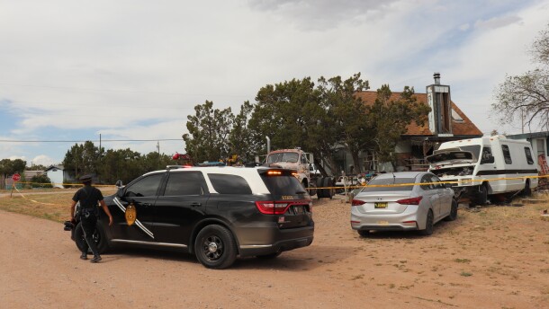 New Mexico State Police respond to home in Mountainair, N.M., where authorities say several people died Wednesday, May 20, 2026, and more than a dozen first responders were exposed to an unknown substance and later treated at a hospital. (AP Photo/Savannah Peters)