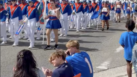 Gainesville residents take in the University of Florida Gator Marching Band at UF's Homecoming Parade on Friday, Oct. 17, 2025. (Sara-James Ranta/WUFT News)