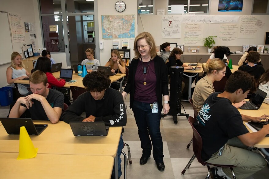 English teacher Jen Roberts checks her student’s work at Point Loma High School in San Diego on May 3, 2024. Roberts uses AI platforms for classroom exercises and grading.