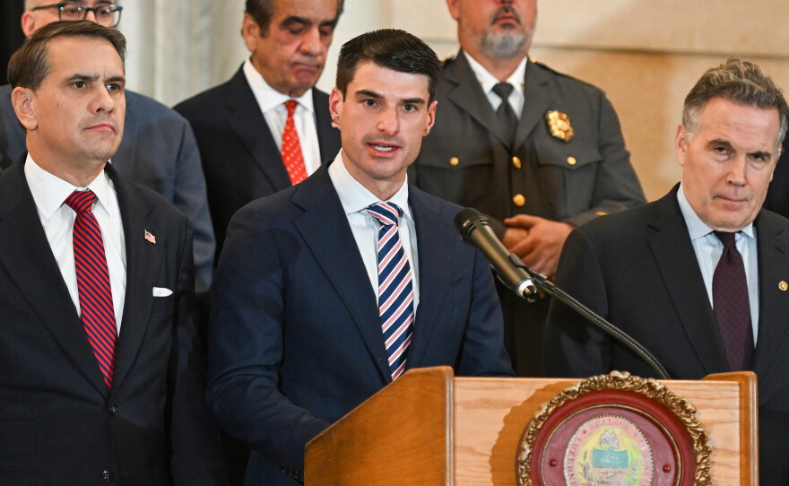 U.S. Rep. Rob Bresnahan, flanked by