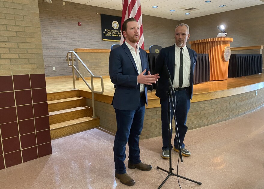  Indiana Democratic Party Chair Mike Schmuhl (left) and 2nd Congressional District candidate Paul Steury speak after the Democratic caucus to fill a special election ballot vacancy on Tuesday, Aug. 23.