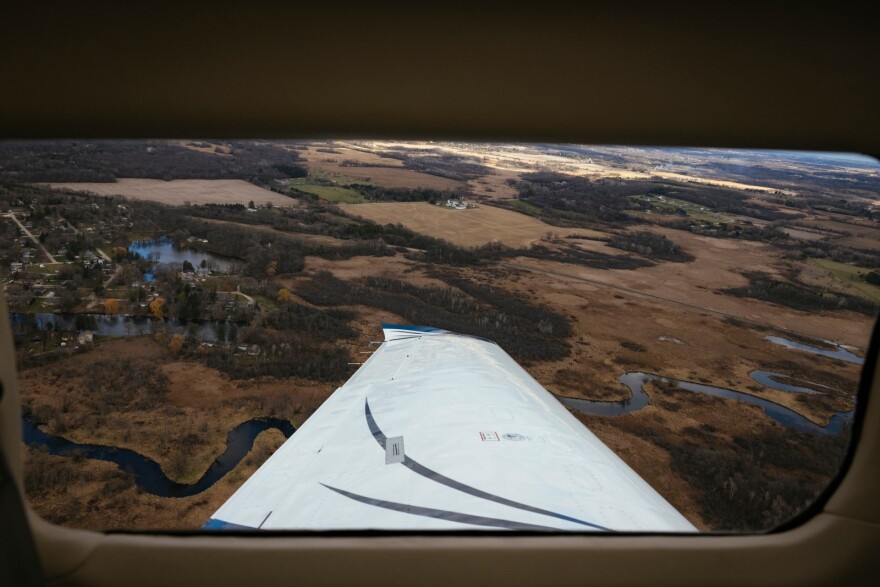 An aerial view from an airplane window. A four-seater plane nicknamed ‘Buzz’ takes flight over the Chicago suburbs as part of a network of volunteer pilots and their aircraft.