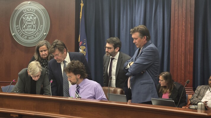 (Right to left) Board of State Canvassers vice chair Mary Ellen Gurewitz, board member Heather Cummings, Chair Richard Houskamp, Deputy Elections Director Adam Fracassi-Wier, Elections Director Jonathan Brater, board member Paul Cordes