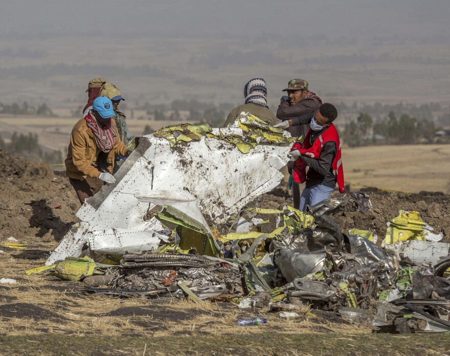 In this March 11, 2019, file photo, rescuers work at the scene of an Ethiopian Airlines flight crash outside of Addis Ababa, Ethiopia.