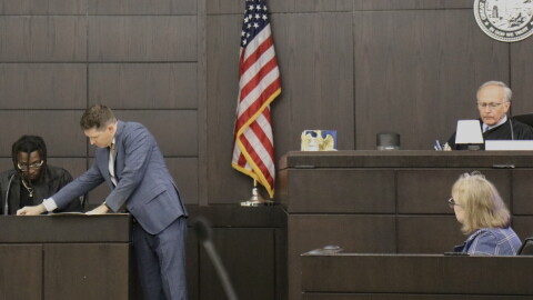 Assistant State Attorney Ryan Nagel shows evidence to Ian “Bob” Munnerlyn during his testimony Wednesday, Sept. 23, 2026. Munnerlyn and his girlfriend, Christin Cassels, lived together at the time of her 2017 killing. (Katie Klaiber/WUFT News)