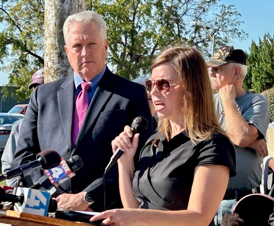 Mayor Jeff Harrington of Bonner Springs, Kansas (L) and Mayor Carolyn Caiharr from Edwardsville, Kansas discuss the future of Wyandotte County government in downtown Kansas City, Kansas.