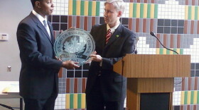 First District Councilman Chris Ford accepts LEED Gold certification plaque.
