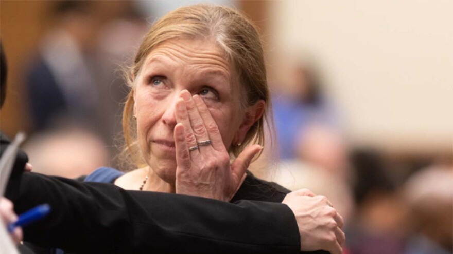 Brigitte Combs wipes away tears after giving testimony on HB 994, which would establishes the legal age of marriage to be 18 years of age and eliminates the ability for a minor to be declared emancipated on the basis of the intent to marry, in front of the Senate committee on Courts of Justice on Wednesday, February 28, 2024 at General Assembly Building in Richmond, Virginia. (Photo by Shaban Athuman, VPM News)