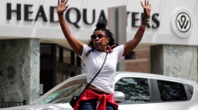 Khadijah Hardaway, vice president and co-founder of Justice for Wyandotte, led the group in chanting "hands up, don't shoot" outside of the Kansas City, Kansas, Police Department.
