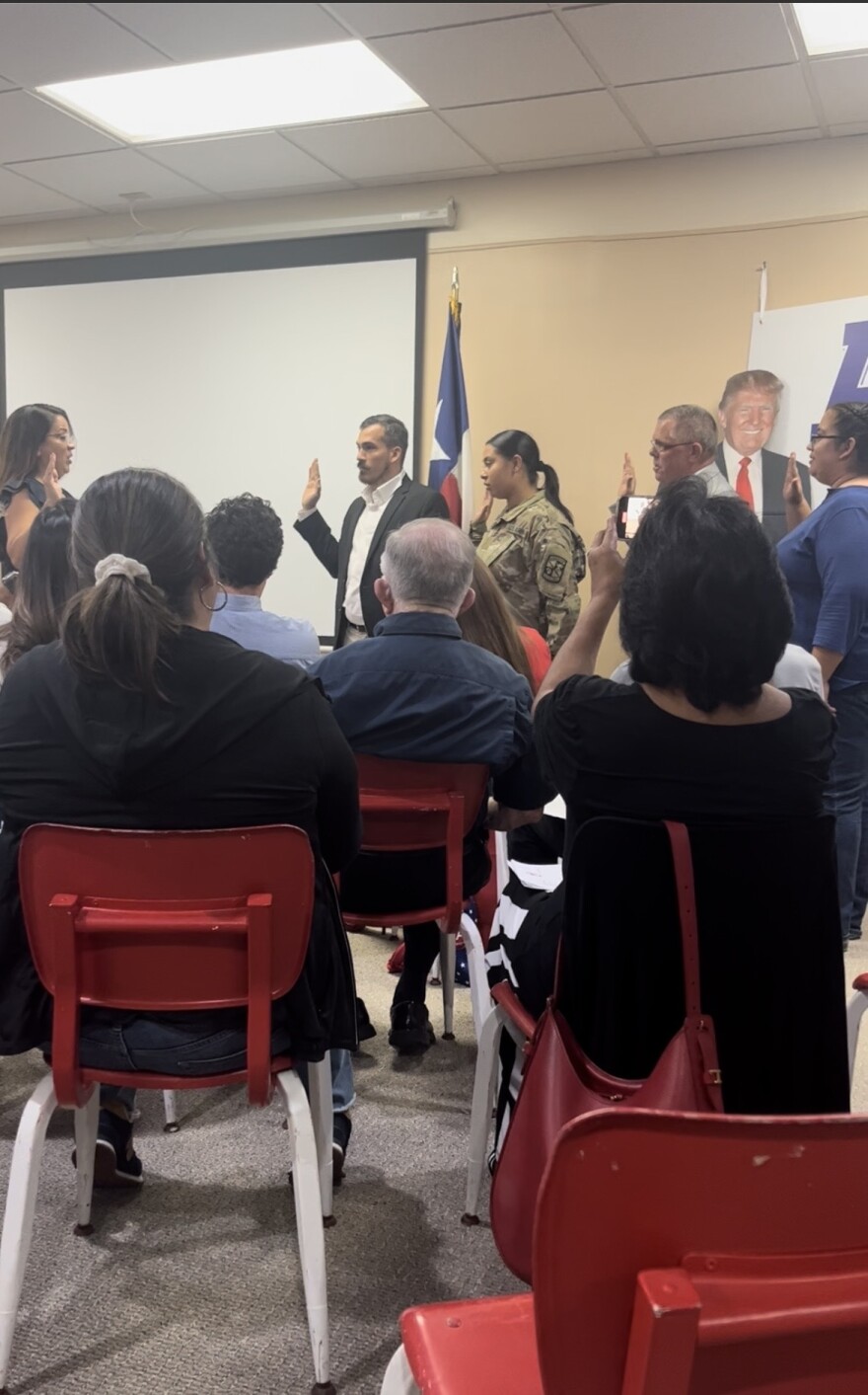 Hidalgo County GOP County Executive Committee (A woman in the audience is using a phone to take pictures.)