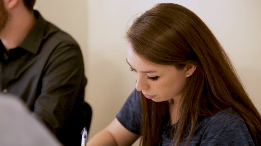 Sierra Roberts takes notes during a meeting at Ohio Mutual.
