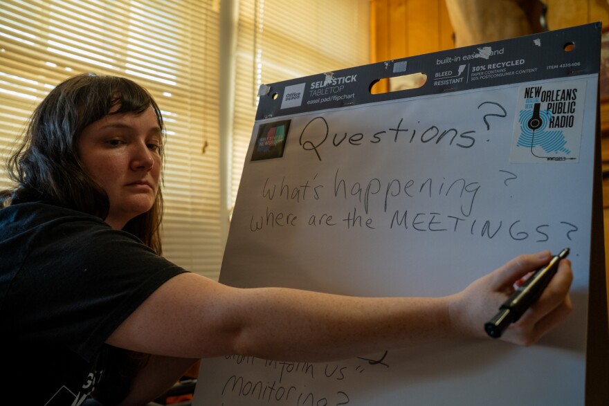 Gulf States Newsroom community engagement producer Nellie Beckett takes notes at a community meeting at Diane Cobb’s home in Holly Ridge, Louisiana, on Saturday, February 28, 2026.