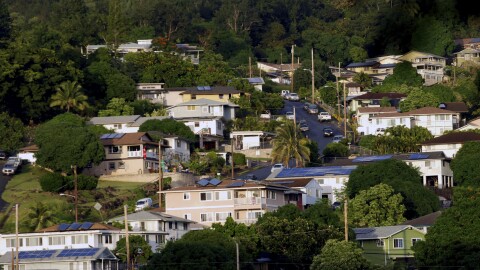 FILE - A neighborhood of single-family homes is shown Thursday, Dec. 24, 2015, in Honolulu. Two-thirds of the single family homes on Hawaiʻi's most populous island have no hurricane protections. This year's return of El Nino is highlighting this weakness because it boosts the odds that more tropical cyclones will travel through Hawaiʻi's waters this summer and fall.