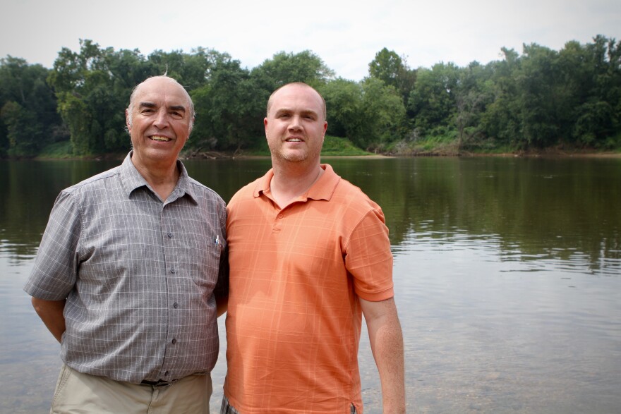 Chief Kenneth Branham and Rufus Elliot wade in at the confluence of the James and Rivanna Rivers, close to where Rassawek, their capital, once thrived.