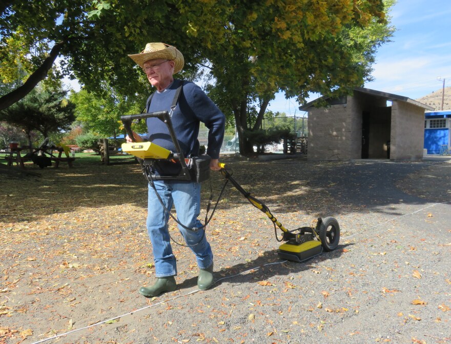 Lew Somers pulls a ground-penetrating radar instrument at Kam Wah Chung State Heritage Site