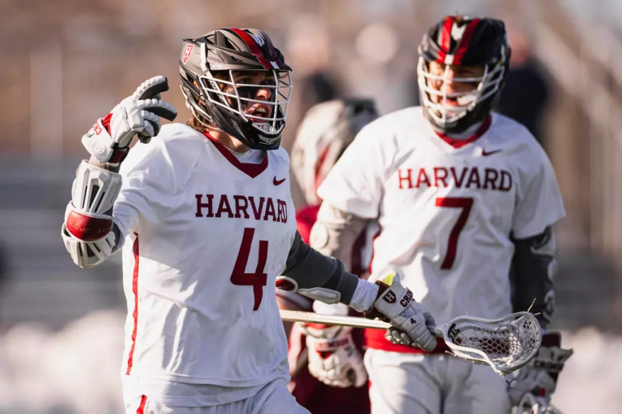 No. 15 Harvard attackman Jack Speidell (4, Crimson) celebrates a tally in its 19-15 loss against Colgate.