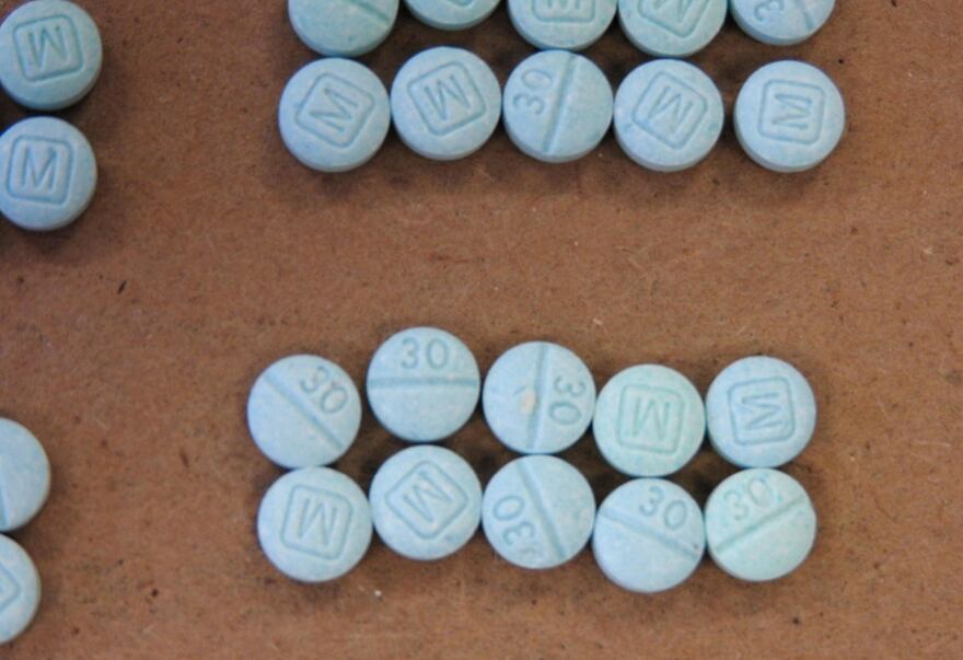 This undated photo provided by the Cuyahoga County Medical Examiner’s Office shows fentanyl pills.