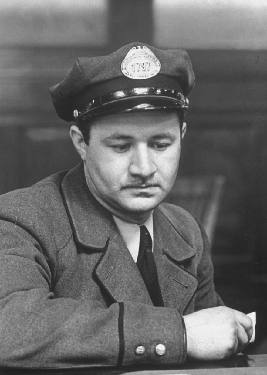 A man at an Internal Revenue information center in New York in 1944