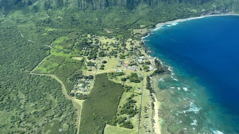 An aerial shot of the remote peninsula of Kalaupapa off of Molokaʻi's northern coastline served as a place of exile for over 8,000 patients of Hansen’s disease from the mid-1800s to 1969.