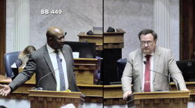 Sen. Greg Taylor (D-Indianapolis), left and Sen. Mike Young (R-Indianapolis) debate the juvenile sentencing bill on the Senate floor.