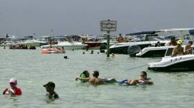 Boaters enjoy the water on the Nixon Beach sandbar off of Key Biscayne on Sunday September 6, 2015.